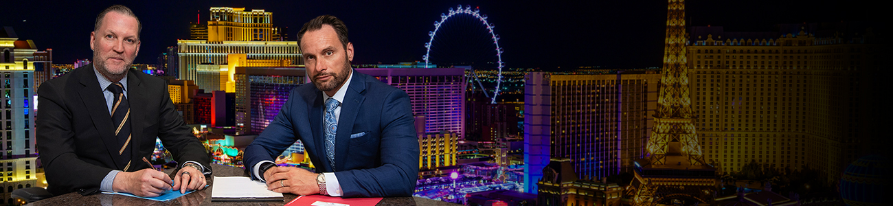 Bradley Hofland and Josh Tomsheck with the Las Vegas skyline in the background.